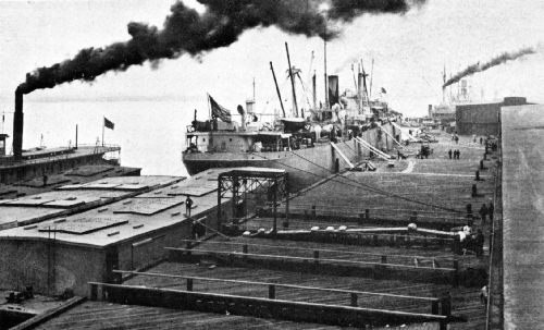 In Foreground—Loading Coffee by Means of an Automatic Traveling-Belt Conveyor, on Government Barges for St. Louis